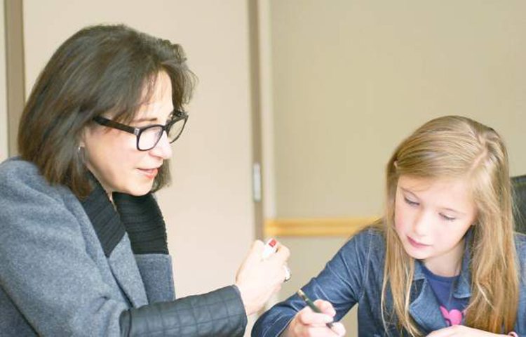 Dr. Deborah Zwick administers a staged psychological test to a school-aged child. Zwick's clients are always kept confidential — that’s why the photo is staged and not with a real patient.